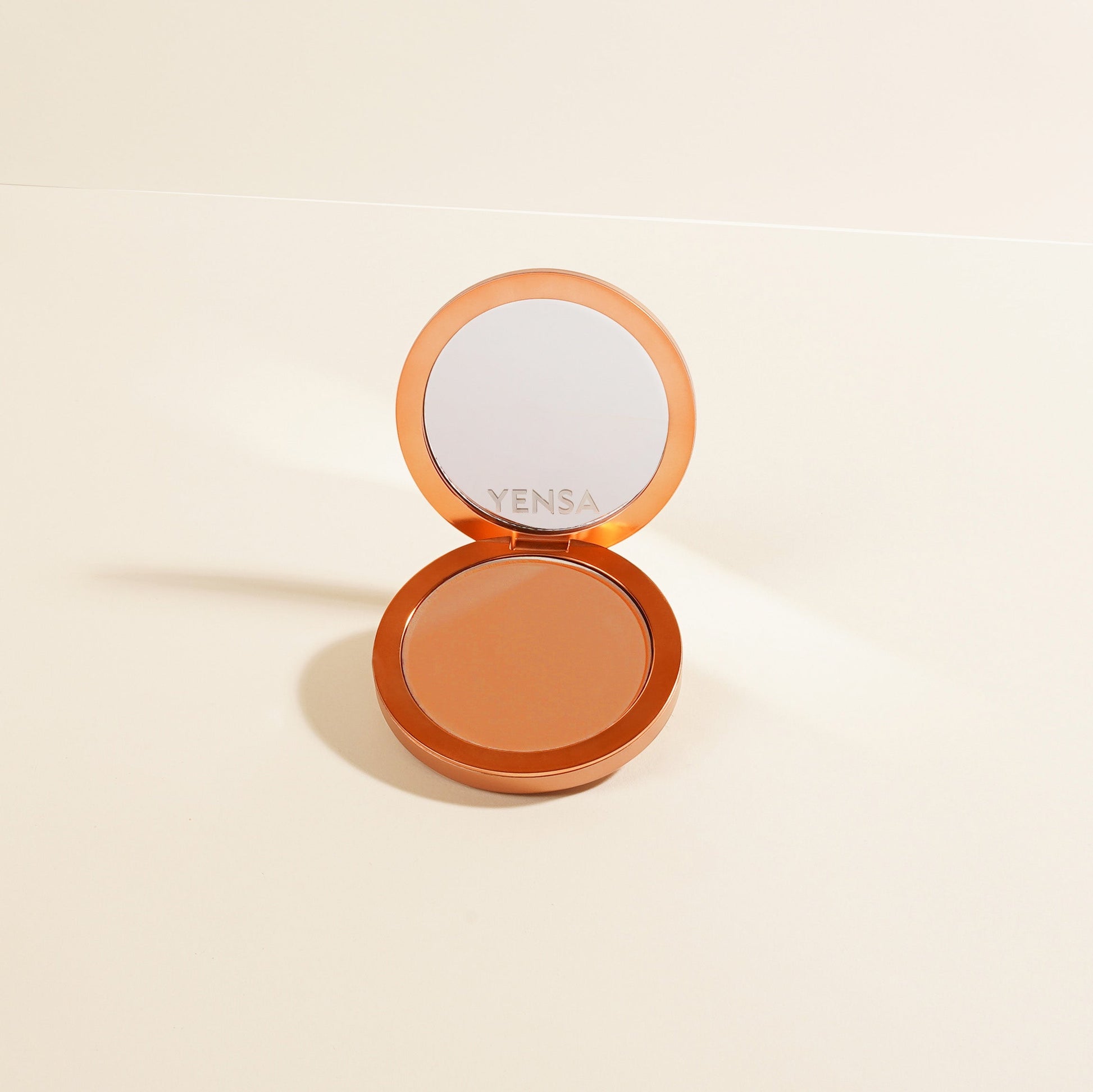 YENSA Super Serum Silk Matte Powder Peptide Foundation in fair shade, showing smooth, powdery texture and elegant packaging.
