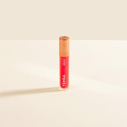 YENSA Luxe Lip Nourishing Oil with Hyaluronic and Vitamin E, featuring a glossy lip oil with a ruby tint in a sleek bottle.