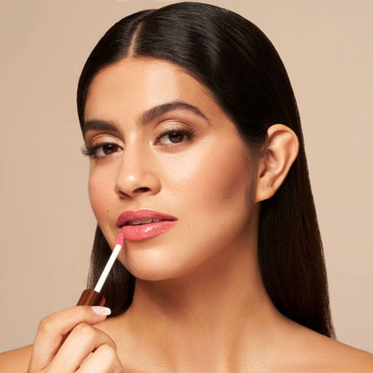 YENSA Luxe Lip Nourishing Oil with Hyaluronic and Vitamin E, featuring a clear lip oil with a hint of red tint in a sleek bottle.