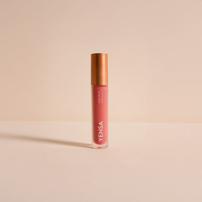 YENSA Luxe Lip Nourishing Oil with Hyaluronic and Vitamin E shown in a sleek lip oil bottle with a clear glossy finish.