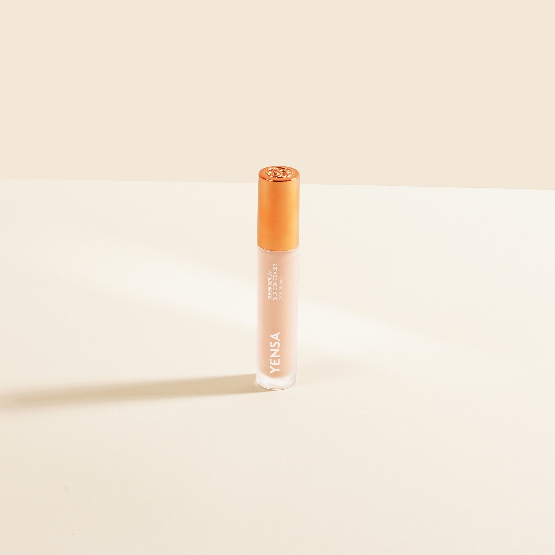 YENSA Super Serum Silk Concealer in fair shade, liquid makeup with smooth finish, displayed in a sleek bottle.