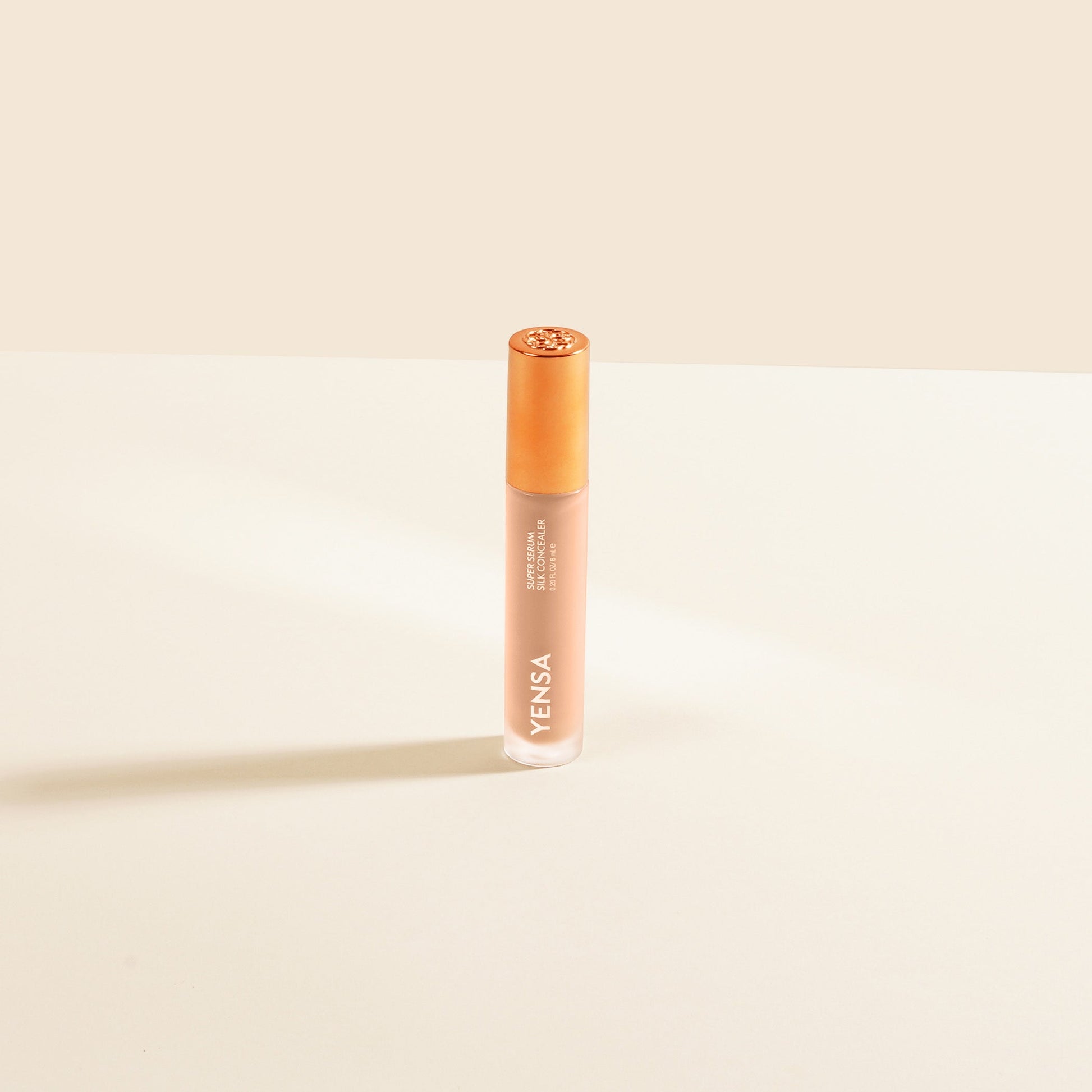 YENSA Super Serum Silk Concealer in fair shade, showing smooth liquid formula and applicator tip for flawless makeup coverage.