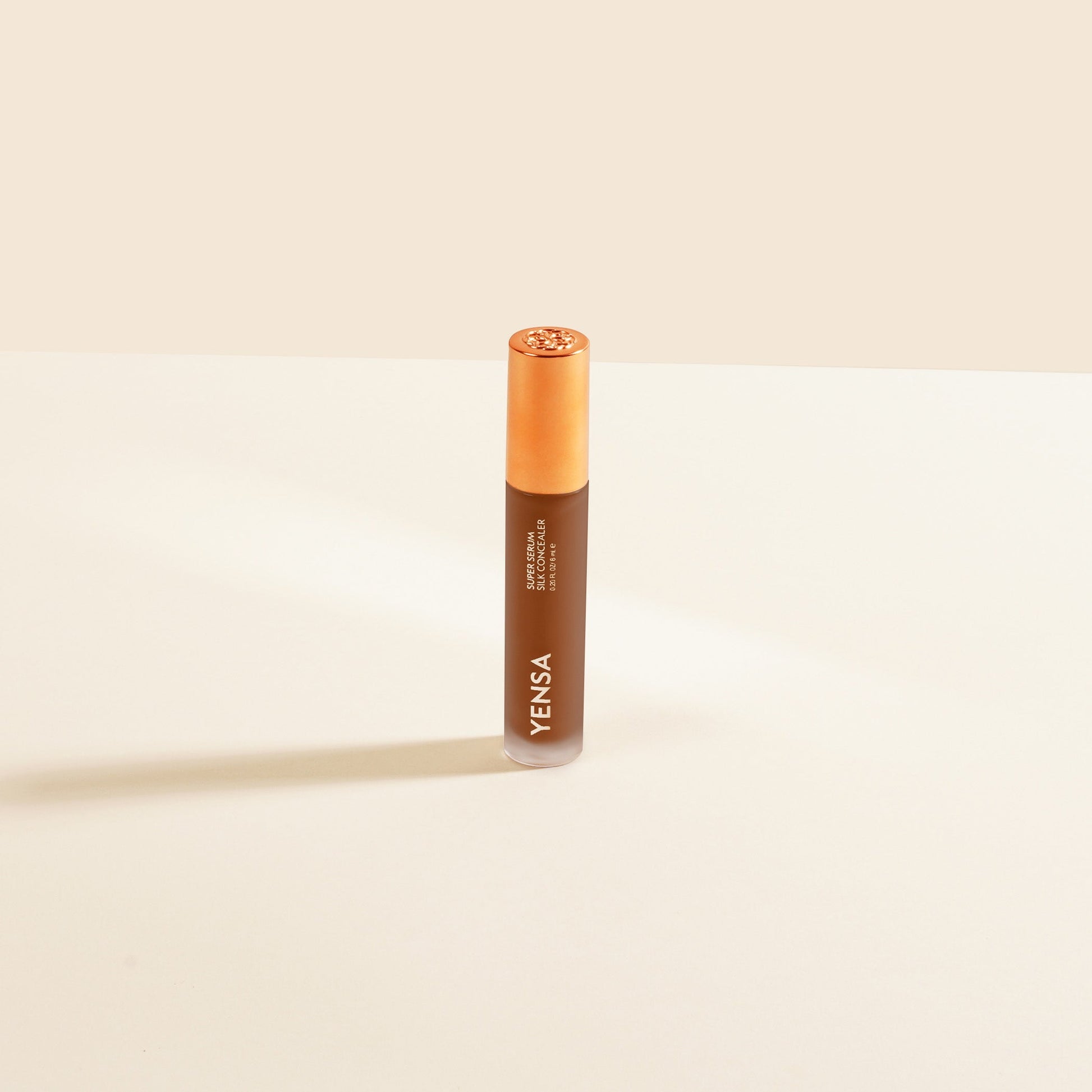 YENSA Super Serum Silk Concealer makeup product with fair shade, featuring smooth, silky texture and sleek packaging.