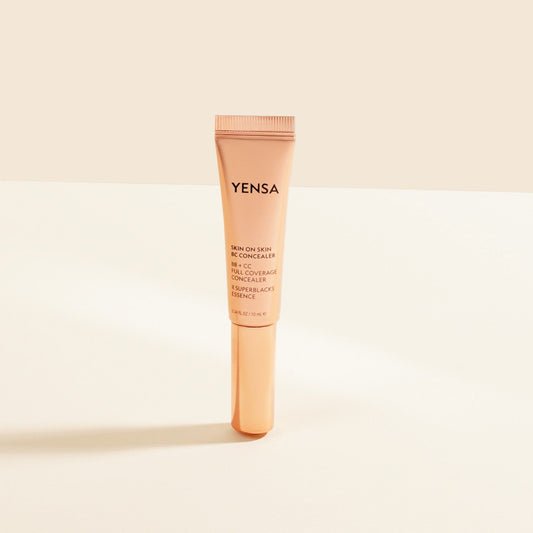 YENSA Skin On Skin BB + CC Full Coverage Hyaluronic Serum Concealer in a beige makeup tube with a black cap.