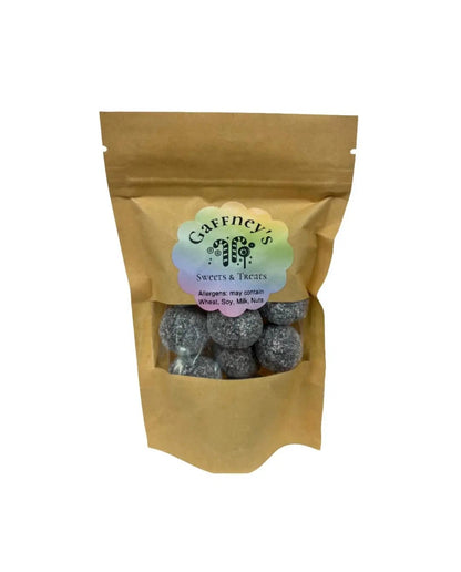 Black Death Mega Sour Candy by Yum At Hart, 100g extreme sour sweets in black packaging, showcasing intense, colorful sour candies.