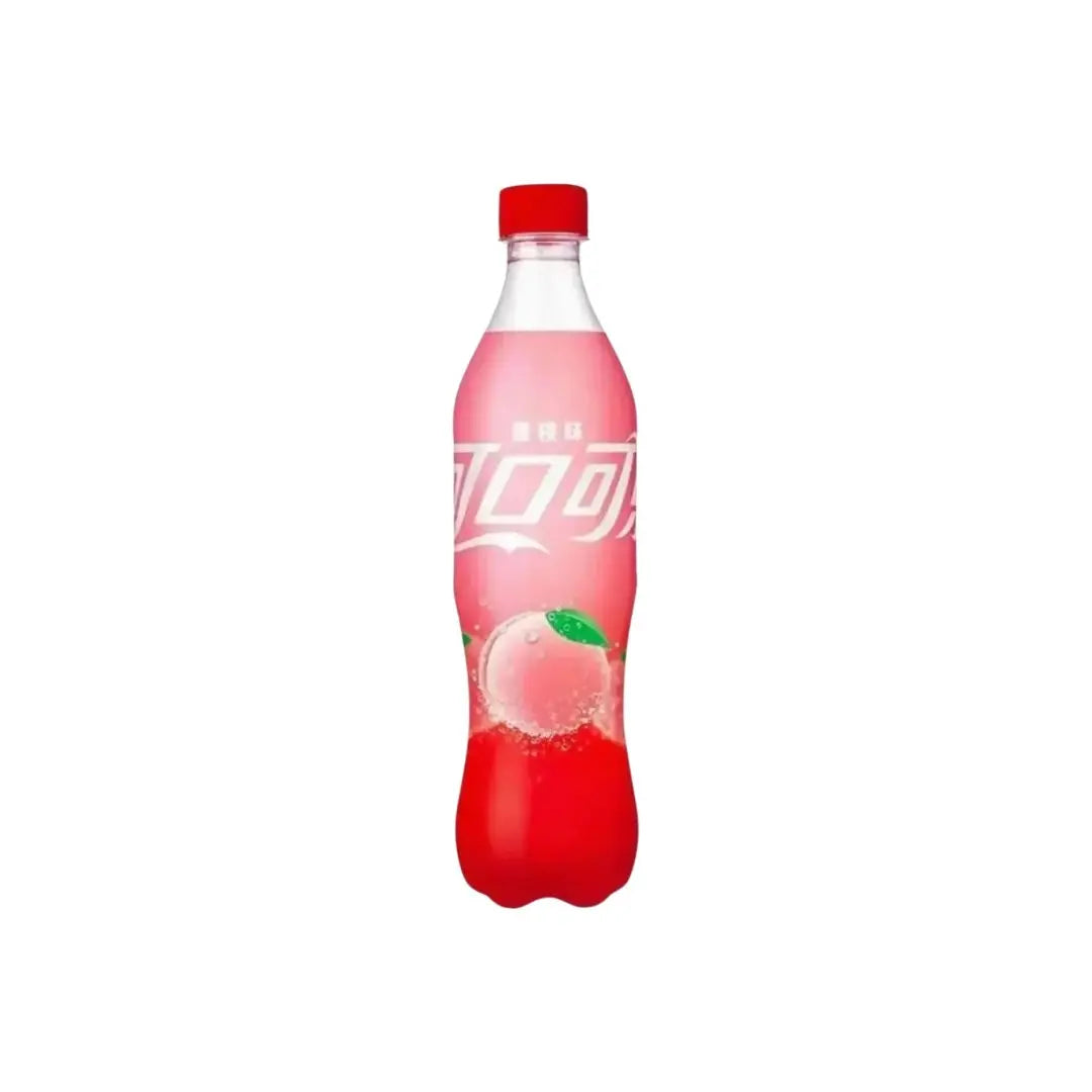 Yum At Hart Coca-Cola Peach flavored soda 500mL bottle with peach image and branding on the label.